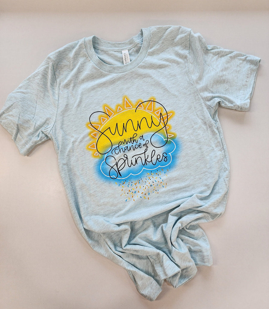 Sunny with a Chance of Sprinkles  - Unisex Bella Canvas Heather Prism Ice Blue T-shirt